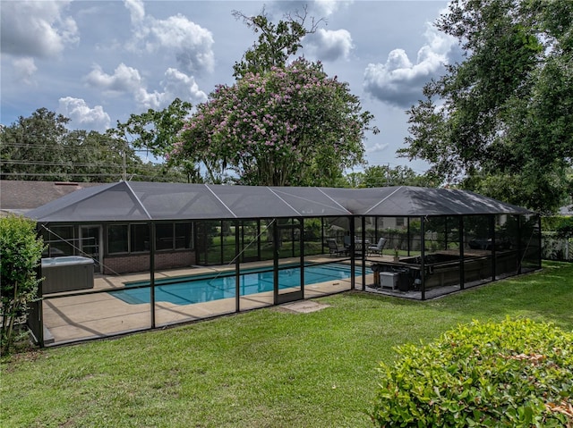609 W Pipkin Rd, Lakeland, FL 33813 - swimming pool with a lawn, a patio area, and a lanai