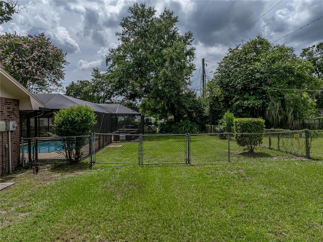 609 W Pipkin Rd, Lakeland, FL 33813 - view of yard featuring a gate and a lanai