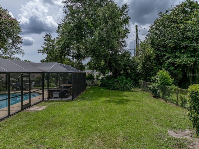 609 W Pipkin Rd, Lakeland, FL 33813 - fenced backyard featuring a lanai
