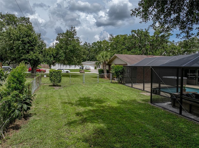 609 W Pipkin Rd, Lakeland, FL 33813 - view of yard with an outdoor pool, a gate, and glass enclosure