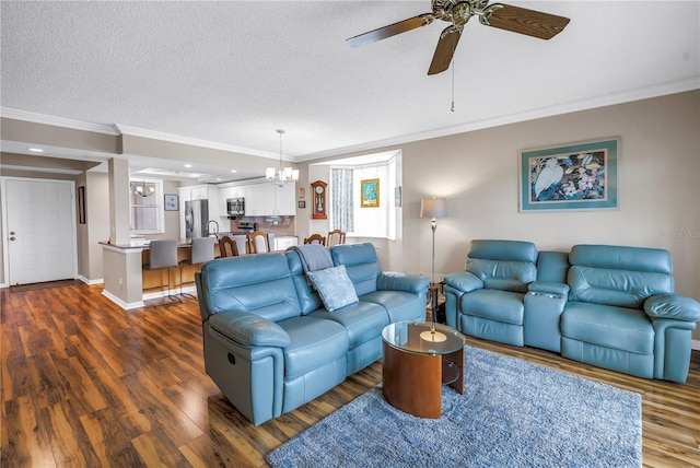 6399 Shoreline Dr Unit 4201, Saint Petersburg, FL 33708 - living area with ornamental molding, a chandelier, dark wood-style floors, a ceiling fan, and a textured ceiling