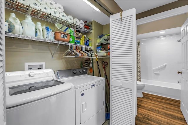 6399 Shoreline Dr Unit 4201, Saint Petersburg, FL 33708 - laundry room with washer and clothes dryer and wood finished floors