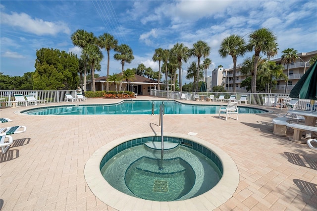6399 Shoreline Dr Unit 4201, Saint Petersburg, FL 33708 - community pool with a community hot tub and a patio