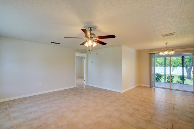 2442 Dando St, Port Charlotte, FL 33948 - empty room with a chandelier, a textured ceiling, and a ceiling fan