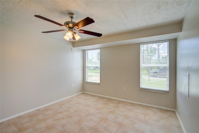 2442 Dando St, Port Charlotte, FL 33948 - unfurnished room with a textured ceiling, light tile patterned floors, and a ceiling fan