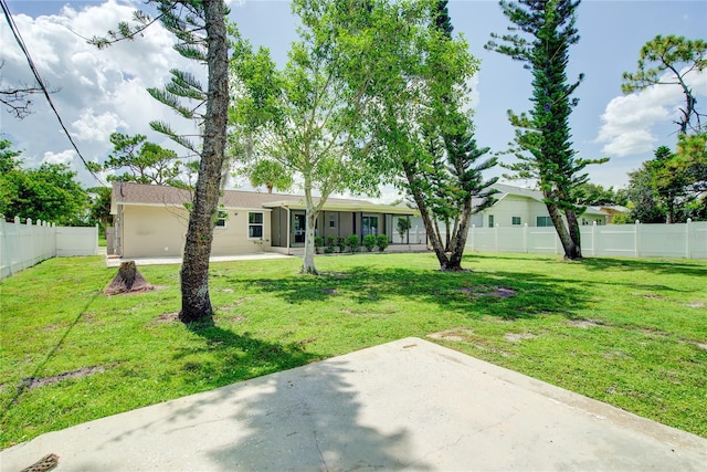 2442 Dando St, Port Charlotte, FL 33948 - back of house with a patio area and a fenced backyard