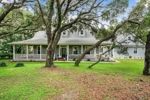828 E Savoy St, Lecanto, FL 34461 - view of front of property featuring a porch and a front yard