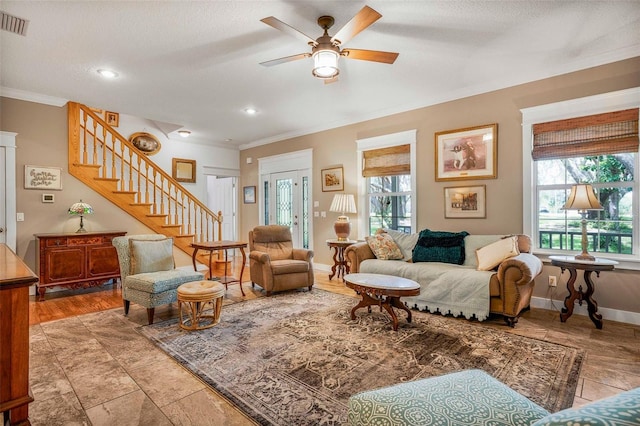 828 E Savoy St, Lecanto, FL 34461 - living area with ornamental molding, stairway, a ceiling fan, and recessed lighting