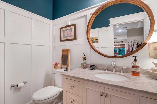828 E Savoy St, Lecanto, FL 34461 - bathroom featuring a decorative wall and vanity