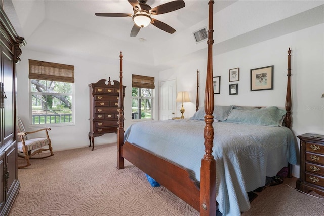 828 E Savoy St, Lecanto, FL 34461 - bedroom with light colored carpet, multiple windows, a tray ceiling, and ceiling fan