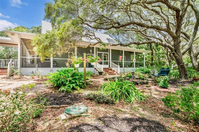 828 E Savoy St, Lecanto, FL 34461 - back of house featuring a sunroom