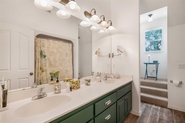 828 E Savoy St, Lecanto, FL 34461 - full bathroom featuring double vanity and wood finished floors