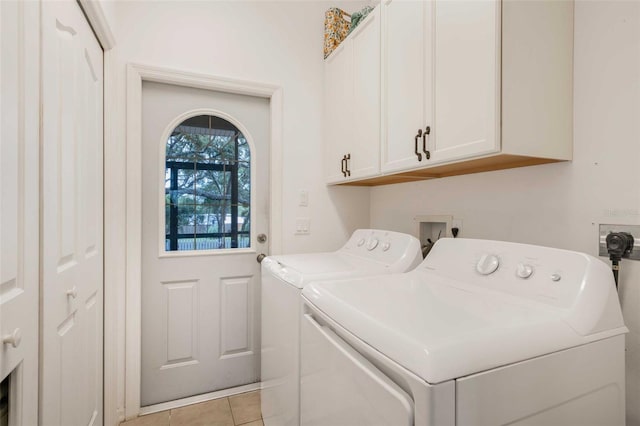 828 E Savoy St, Lecanto, FL 34461 - laundry room with independent washer and dryer, cabinet space, and light tile patterned flooring