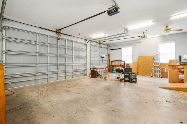 828 E Savoy St, Lecanto, FL 34461 - garage with a garage door opener and ceiling fan