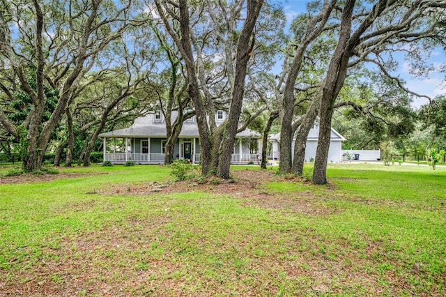 828 E Savoy St, Lecanto, FL 34461 - view of front facade featuring covered porch and a front yard