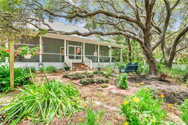828 E Savoy St, Lecanto, FL 34461 - rear view of property featuring a sunroom