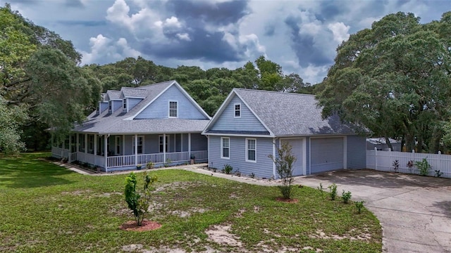 828 E Savoy St, Lecanto, FL 34461 - view of front of property with covered porch, roof with shingles, and a garage