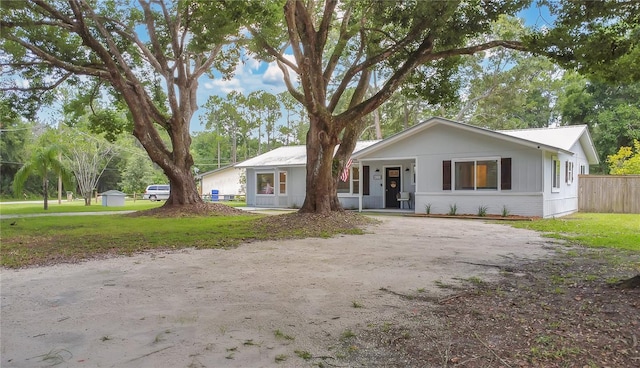 4233 Oak Ln, Saint Augustine, FL 32086 - view of front of house featuring dirt driveway and brick siding