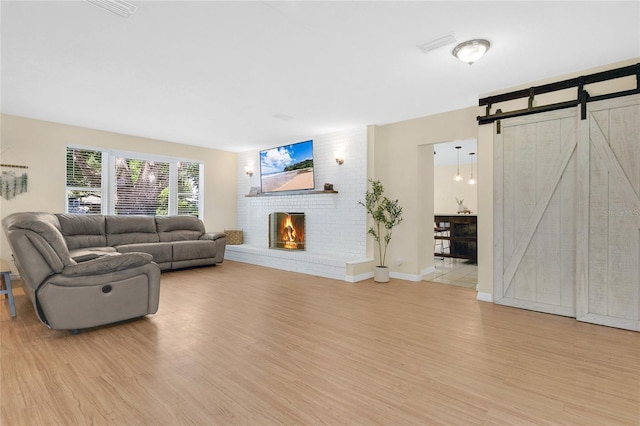 4233 Oak Ln, Saint Augustine, FL 32086 - living room with wood finished floors and a brick fireplace