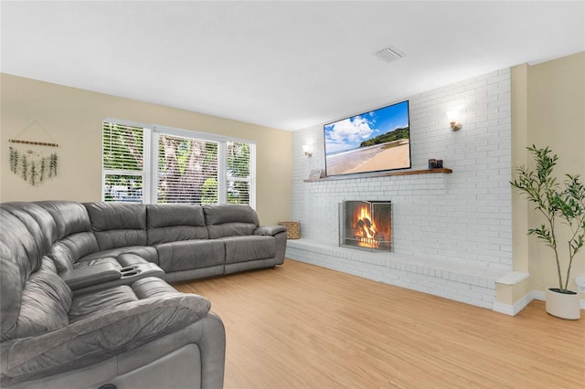 4233 Oak Ln, Saint Augustine, FL 32086 - living room featuring wood finished floors and a fireplace