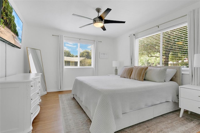 4233 Oak Ln, Saint Augustine, FL 32086 - bedroom with light wood finished floors and a ceiling fan
