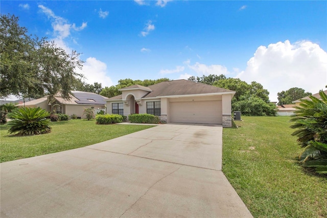161 Oak Crossing Blvd, Auburndale, FL 33823 - single story home featuring stucco siding, a garage, concrete driveway, and a front lawn