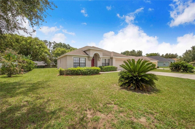 161 Oak Crossing Blvd, Auburndale, FL 33823 - single story home featuring a garage, a front lawn, and stucco siding