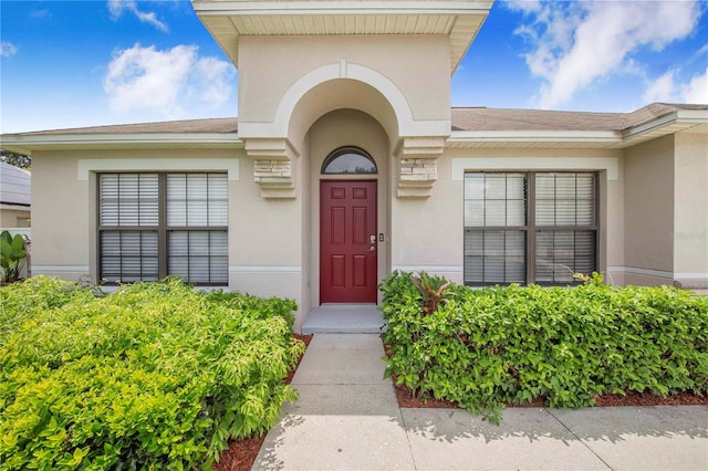 161 Oak Crossing Blvd, Auburndale, FL 33823 - property entrance with stucco siding