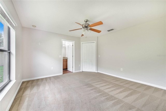 161 Oak Crossing Blvd, Auburndale, FL 33823 - unfurnished bedroom featuring carpet floors, a ceiling fan, ensuite bath, and a closet