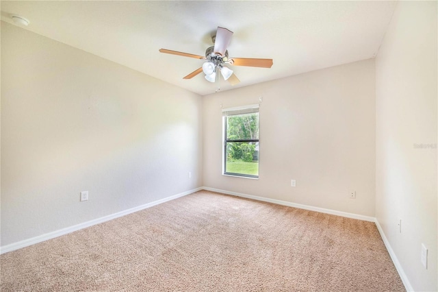 161 Oak Crossing Blvd, Auburndale, FL 33823 - unfurnished room with light carpet, a ceiling fan, and a smoke detector