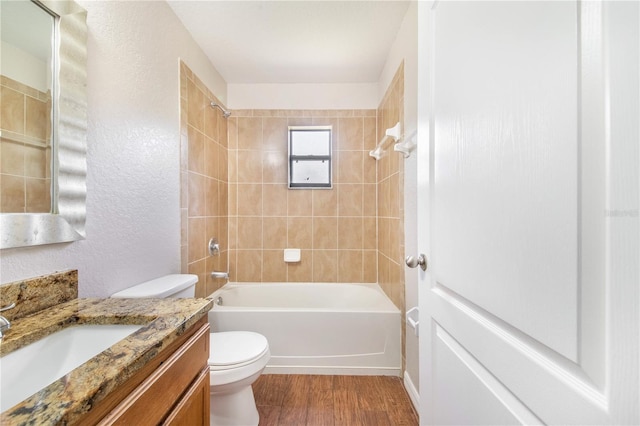 161 Oak Crossing Blvd, Auburndale, FL 33823 - full bath featuring vanity, bathing tub / shower combination, wood finished floors, and a textured wall