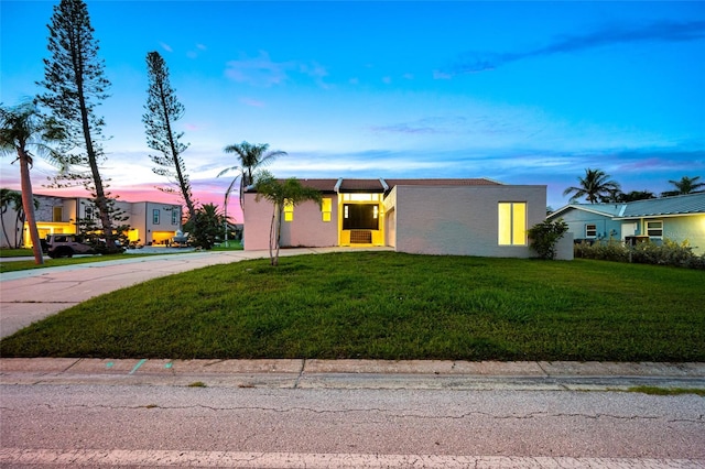 809 59th Ave, Saint Petersburg, FL 33706 - view of front of property with a lawn, stucco siding, and driveway