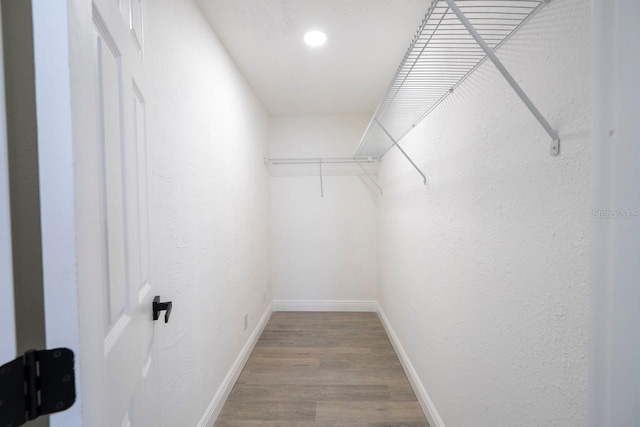 809 59th Ave, Saint Petersburg, FL 33706 - walk in closet featuring wood finished floors
