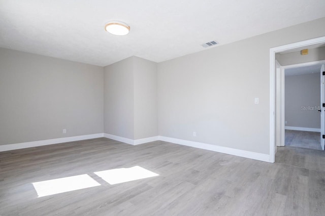 809 59th Ave, Saint Petersburg, FL 33706 - empty room with wood finished floors and baseboards
