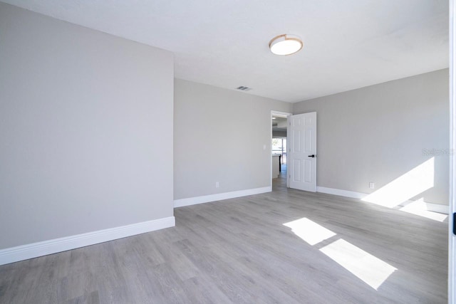 809 59th Ave, Saint Petersburg, FL 33706 - unfurnished room featuring wood finished floors and baseboards