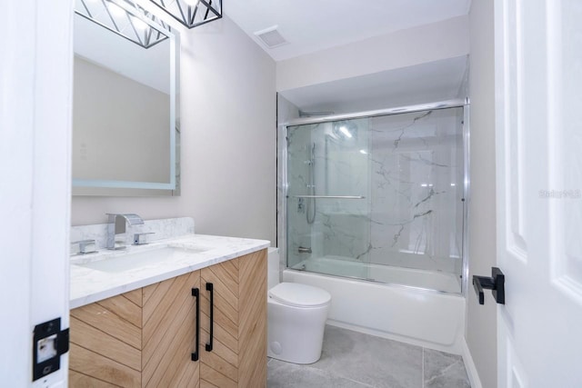 809 59th Ave, Saint Petersburg, FL 33706 - full bath featuring vanity, shower / bath combination with glass door, and tile patterned floors