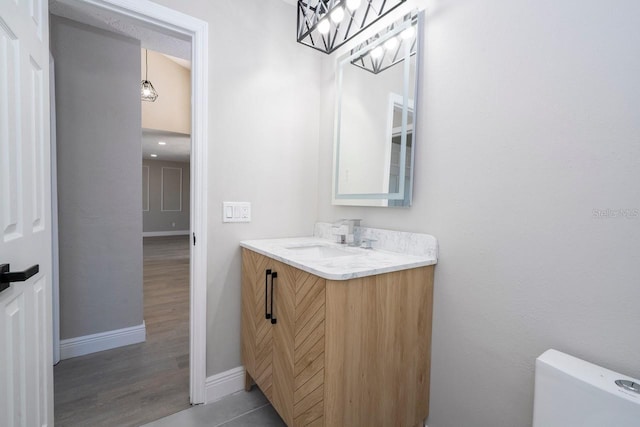 809 59th Ave, Saint Petersburg, FL 33706 - half bath featuring vanity and wood finished floors