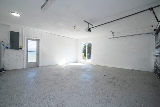 809 59th Ave, Saint Petersburg, FL 33706 - garage featuring electric panel, a garage door opener, and water heater