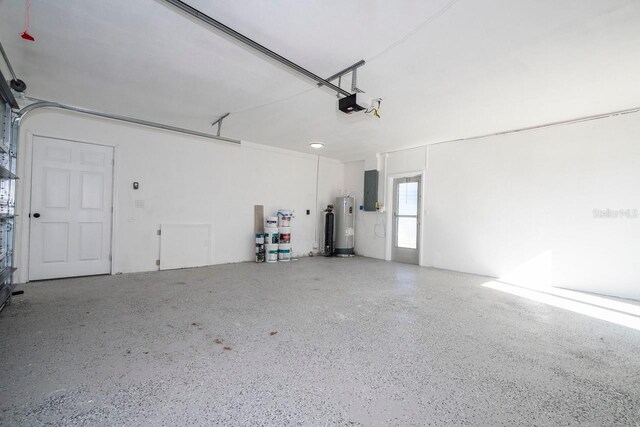 809 59th Ave, Saint Petersburg, FL 33706 - garage with electric water heater, electric panel, and a garage door opener