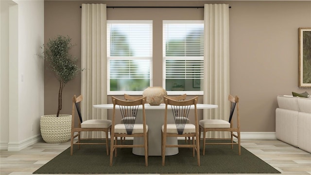 11753 71st Ave E, Palmetto, FL 34221 - dining area featuring wood finished floors and plenty of natural light