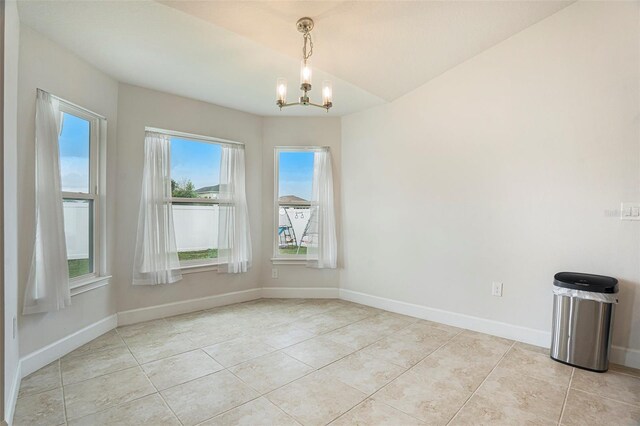 11539 Sunder Berry St, Hudson, FL 34667 - spare room featuring a chandelier and light tile patterned floors