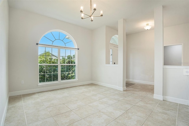 11539 Sunder Berry St, Hudson, FL 34667 - spare room featuring a chandelier and light tile patterned floors