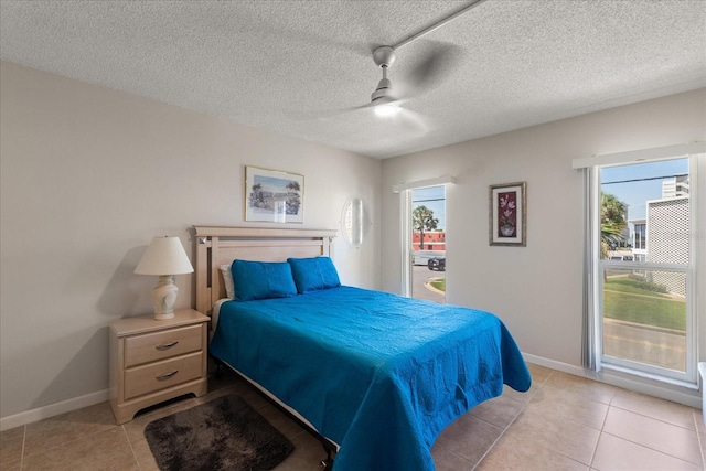 7003 Sunset Way Unit 6, St Pete Beach, FL 33706 - bedroom with multiple windows, light tile patterned flooring, and a ceiling fan