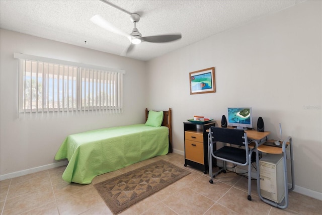 7003 Sunset Way Unit 6, St Pete Beach, FL 33706 - tiled bedroom featuring a textured ceiling and ceiling fan