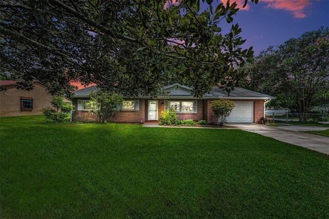 607 Spring Blossom Ct, Brandon, FL 33511 - ranch-style home featuring concrete driveway, a garage, and brick siding