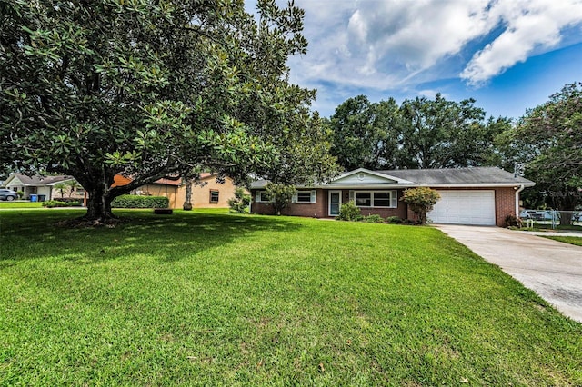 607 Spring Blossom Ct, Brandon, FL 33511 - ranch-style home featuring an attached garage, concrete driveway, brick siding, and a front lawn