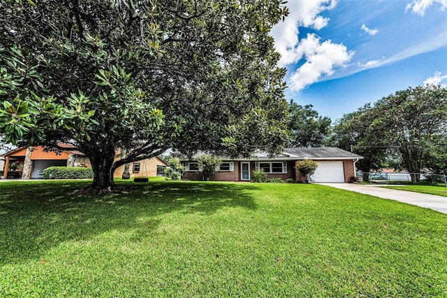 607 Spring Blossom Ct, Brandon, FL 33511 - ranch-style home with concrete driveway, brick siding, a garage, and a front yard