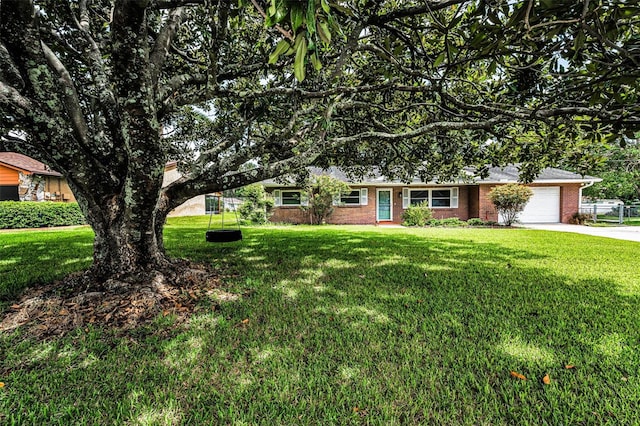 607 Spring Blossom Ct, Brandon, FL 33511 - ranch-style home with a front lawn, brick siding, a garage, and concrete driveway
