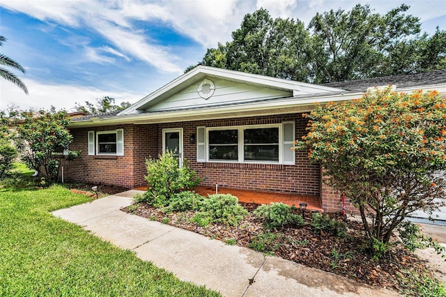 607 Spring Blossom Ct, Brandon, FL 33511 - view of front of house with brick siding and a front lawn