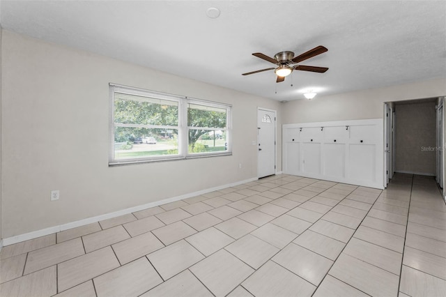 607 Spring Blossom Ct, Brandon, FL 33511 - spare room with ceiling fan and light tile patterned flooring